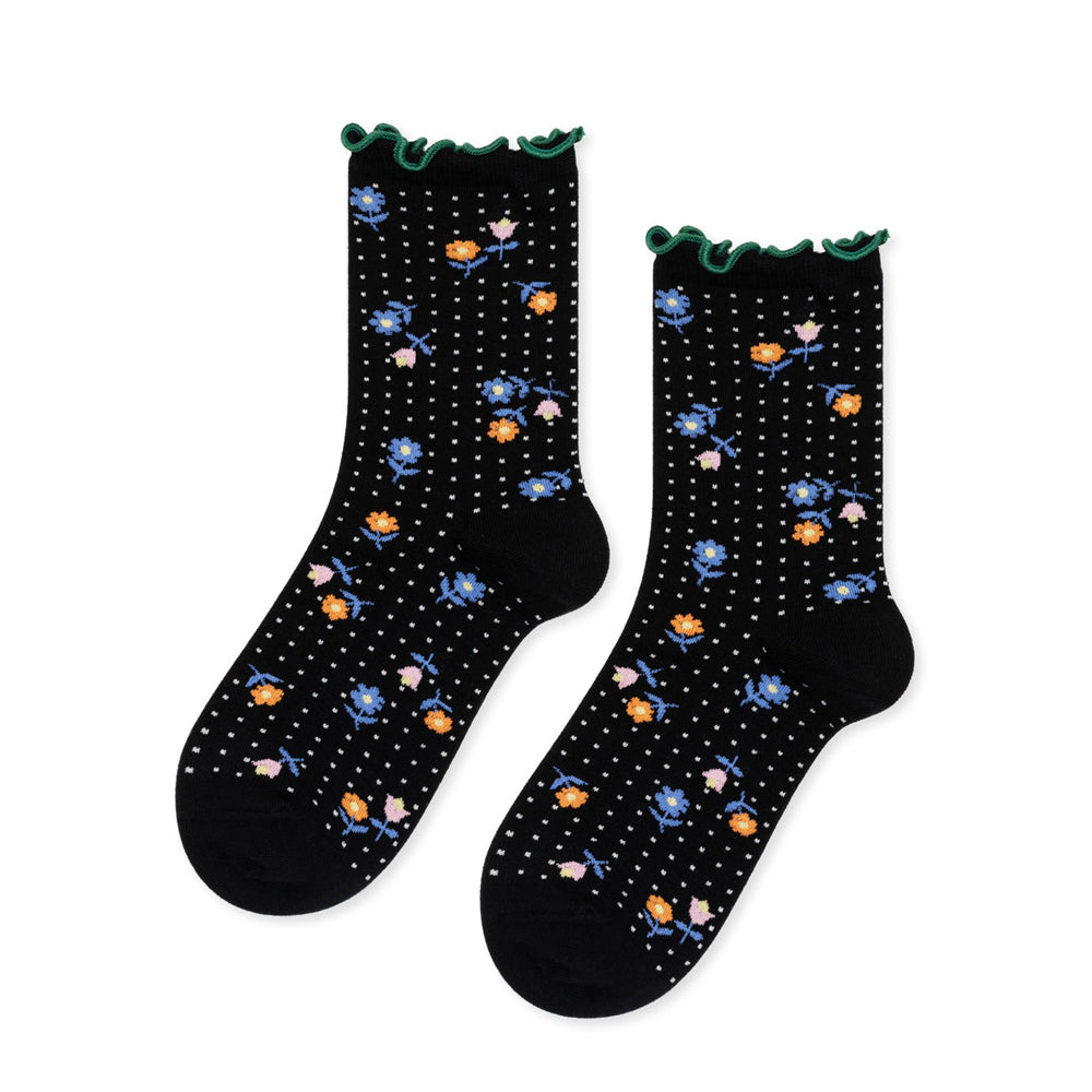 Black socks with floral patterns on a white background
