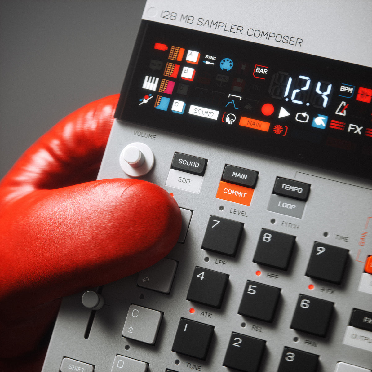 Hand wearing a red glove interacting with a digital audio workstation