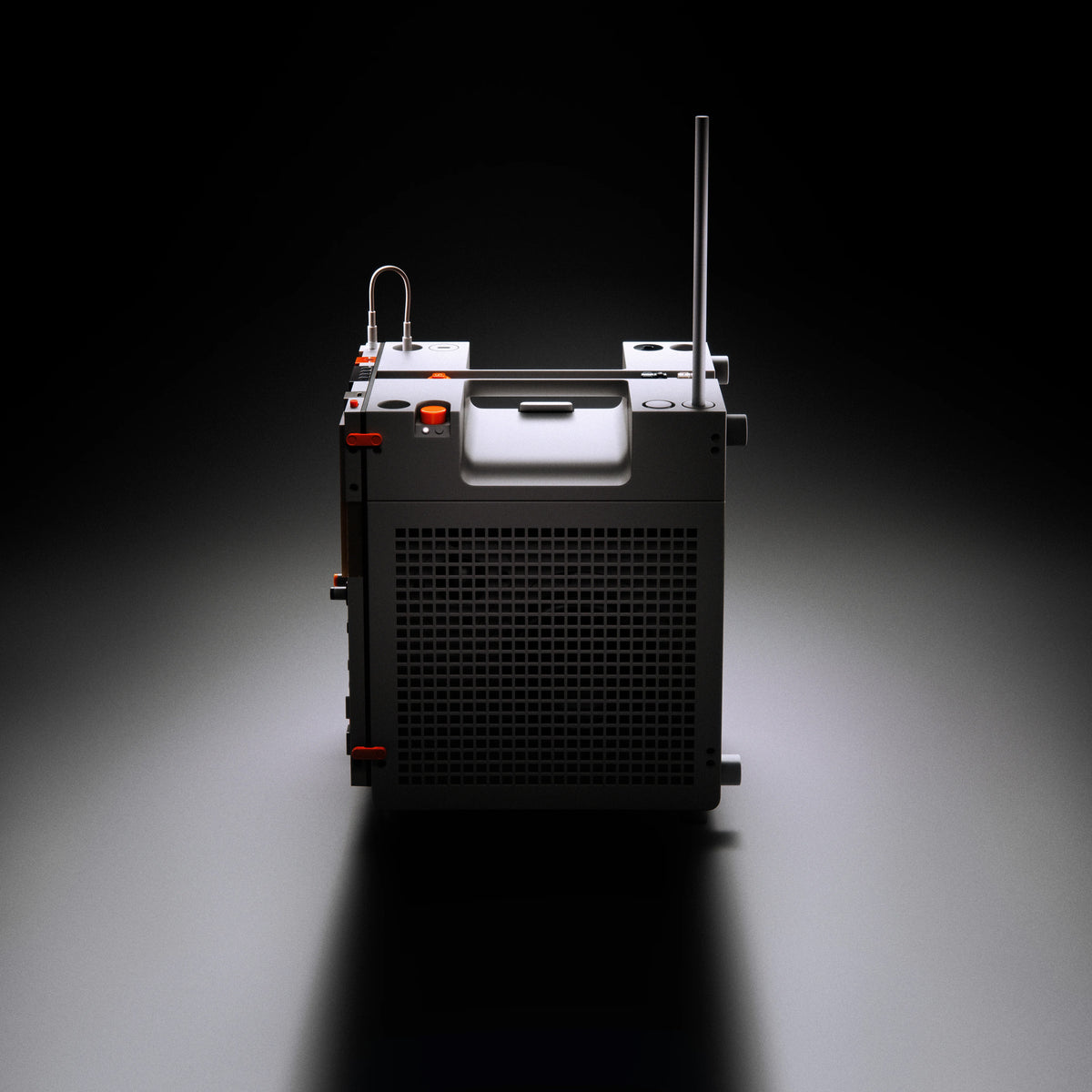 An amp with a front grille, a vertical antenna, and a small curved wire attachment, photographed on a dark studio background with a spotlight effect.