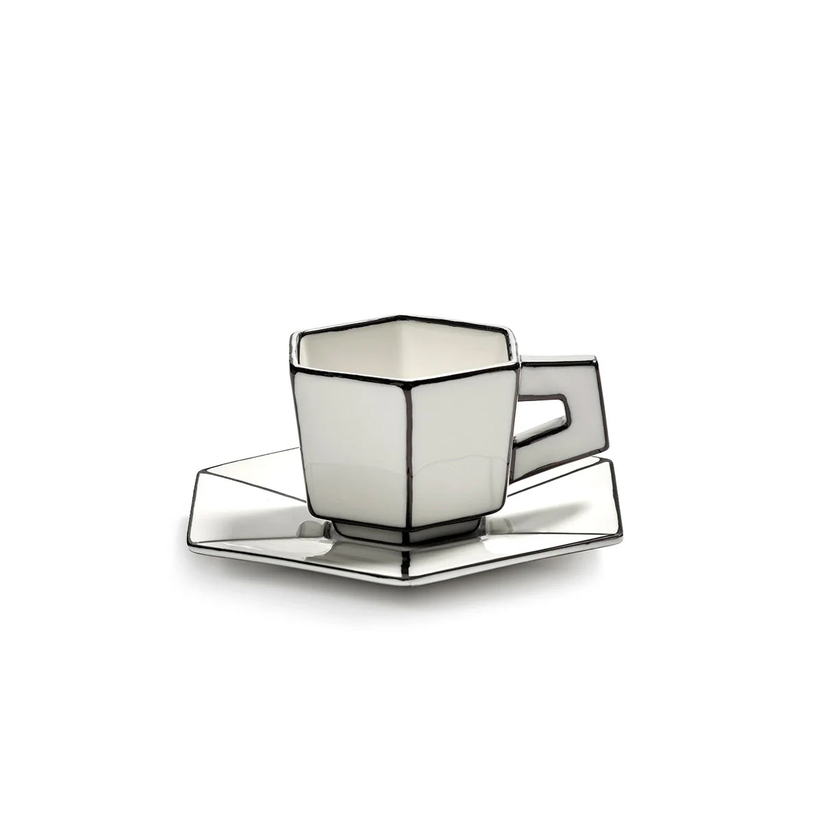 Decorative white cup and saucer set on a white background