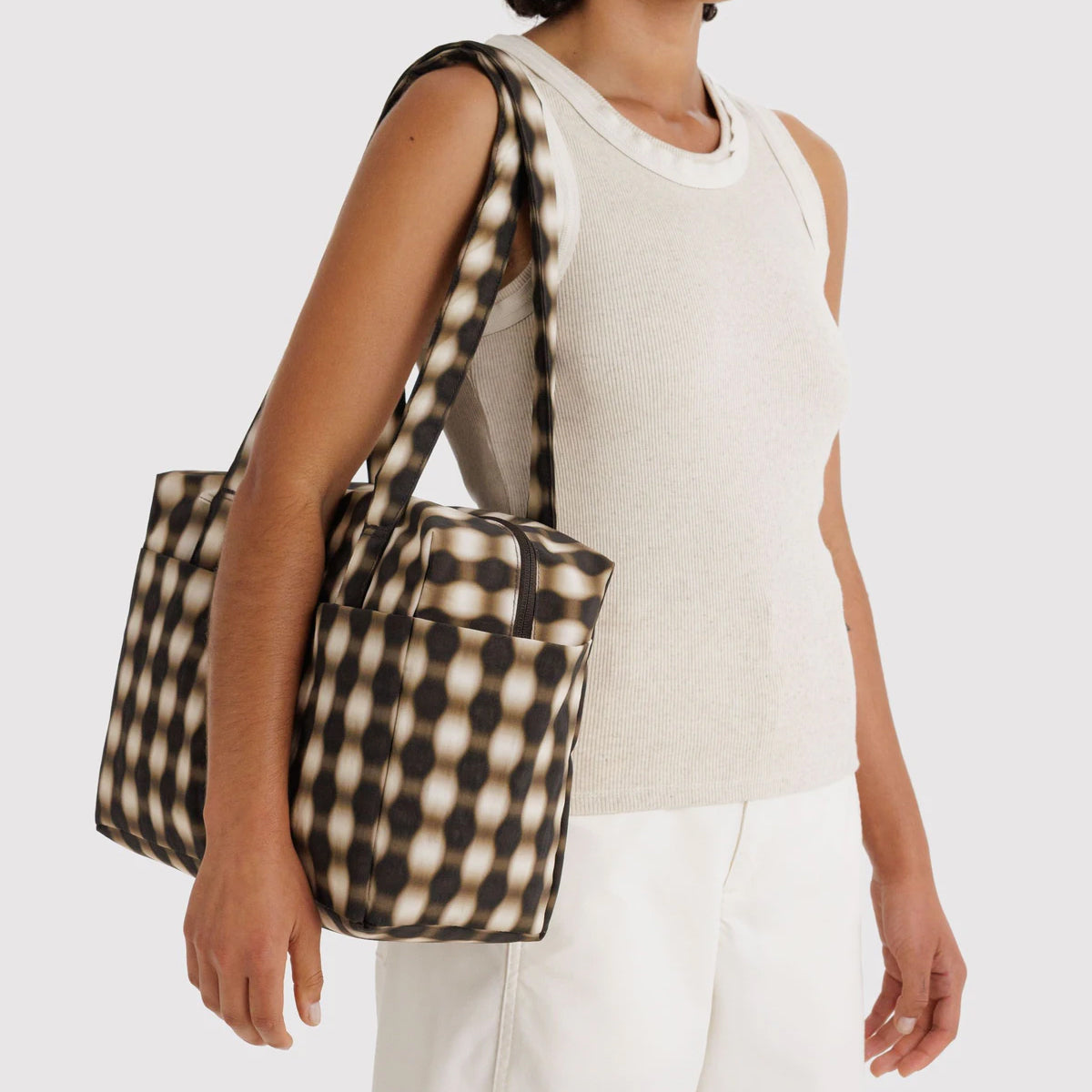 Black and white checkered handbag on a white background