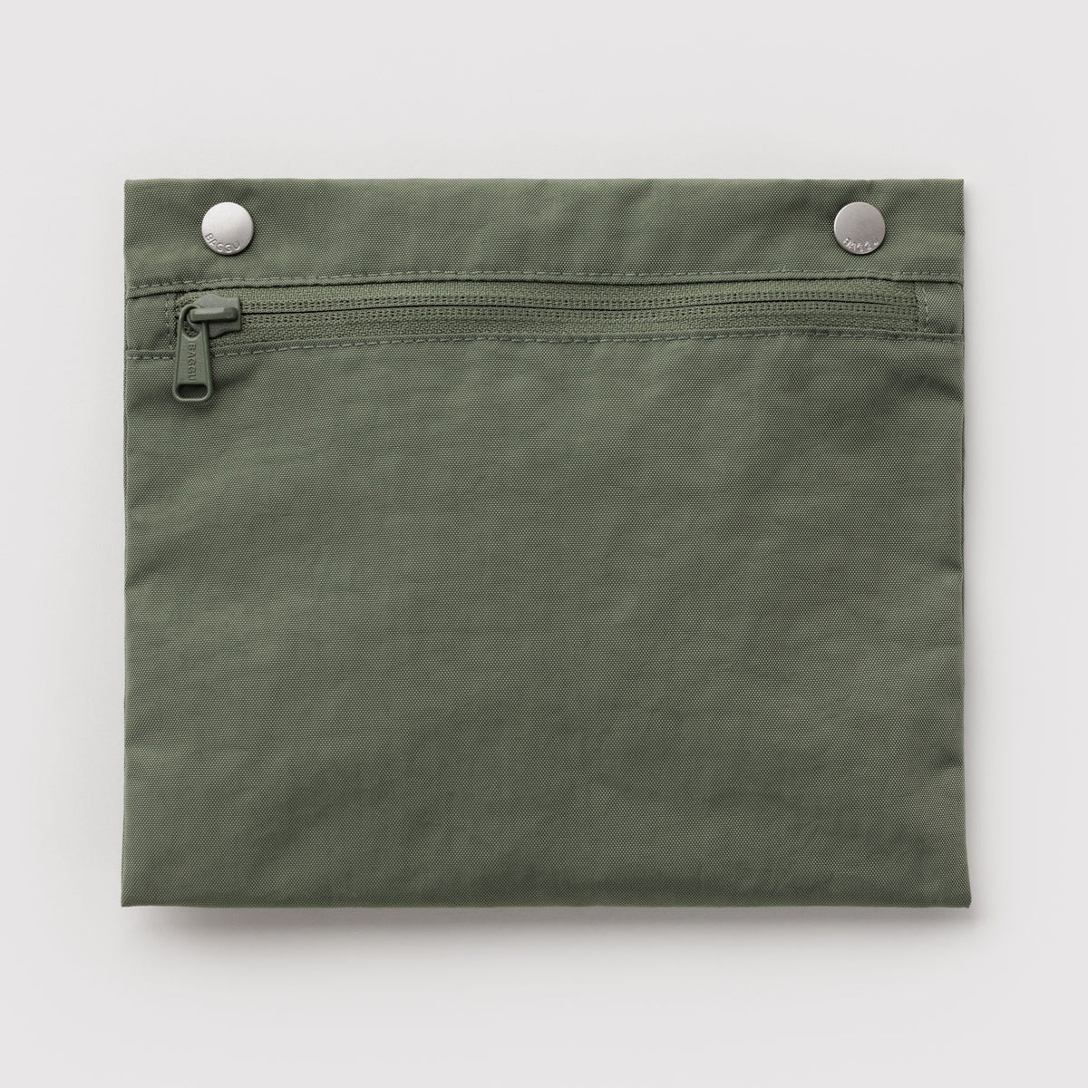 An olive green fabric pouch with a horizontal zipper across the top and two silver metal snap buttons on the waistband, shown flat against a light gray background.
