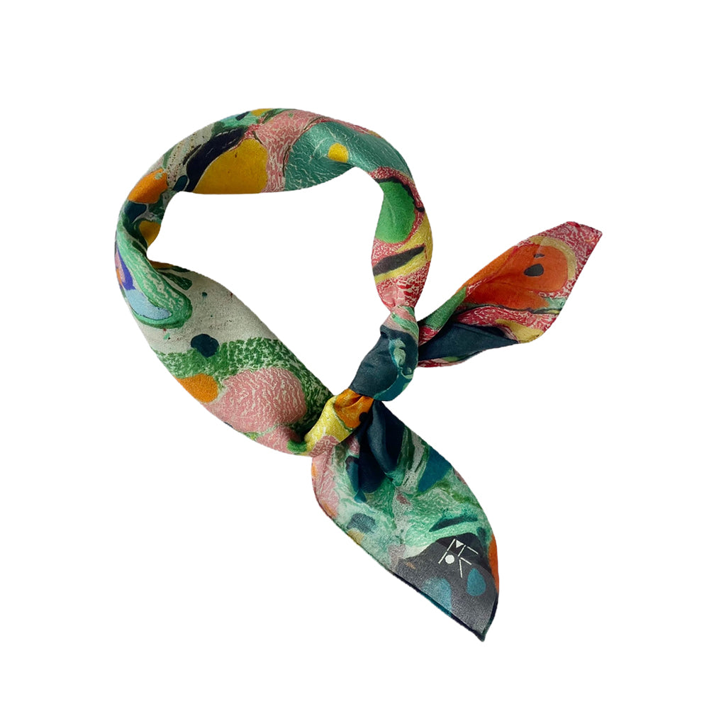 A square scarf featuring a vibrant, multicolored abstract marbled pattern with yellow, pink, green, blue, and black swirls.