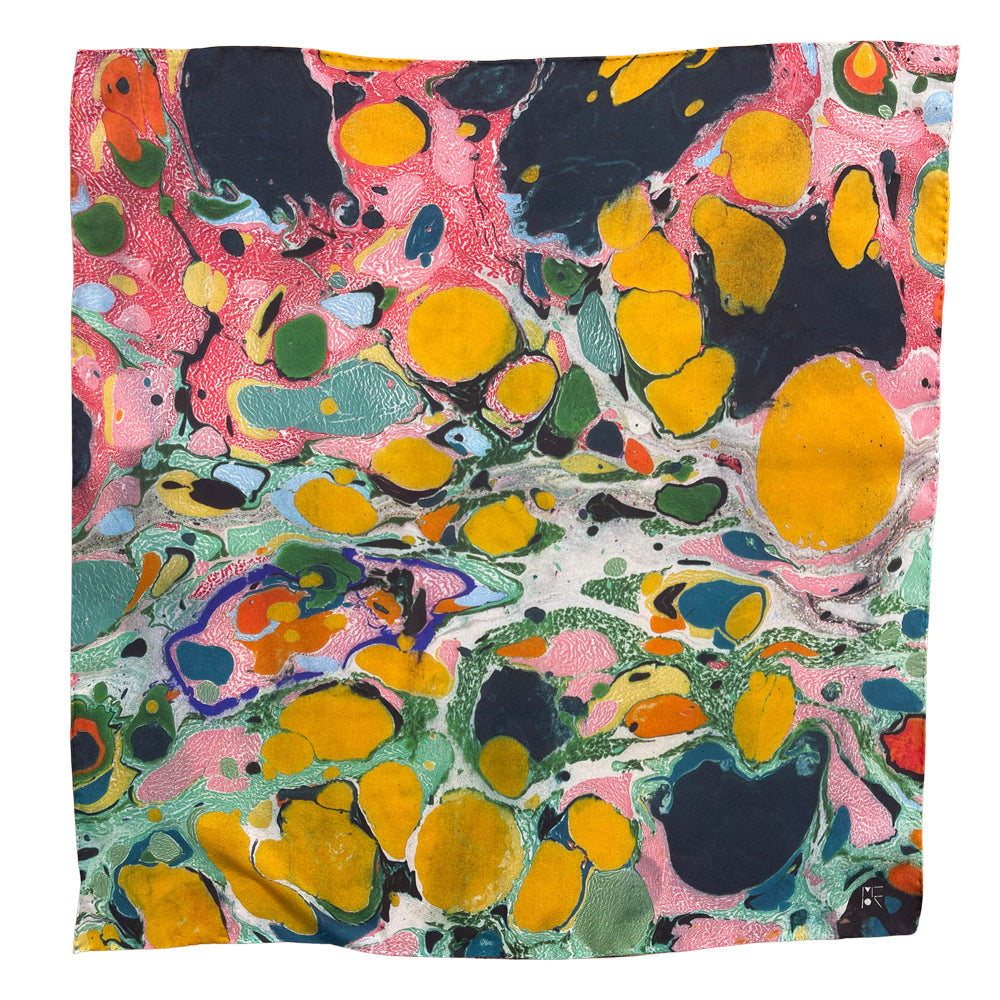 A square scarf featuring a vibrant, multicolored abstract marbled pattern with yellow, pink, green, blue, and black swirls.