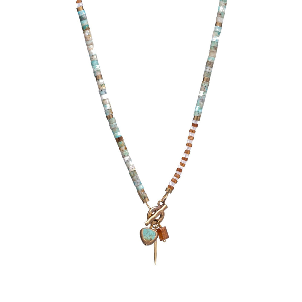 Necklace with multicolored beads and a pendant on a white background