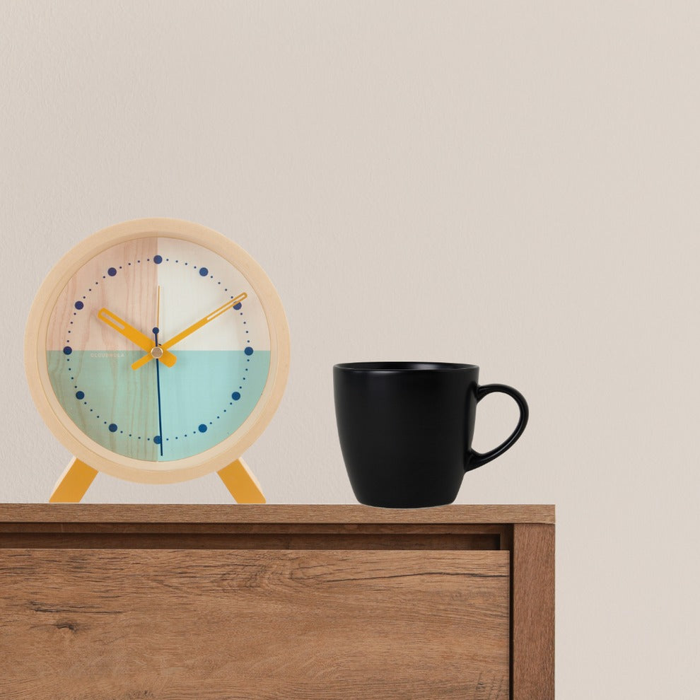 Alarm clock on side table.