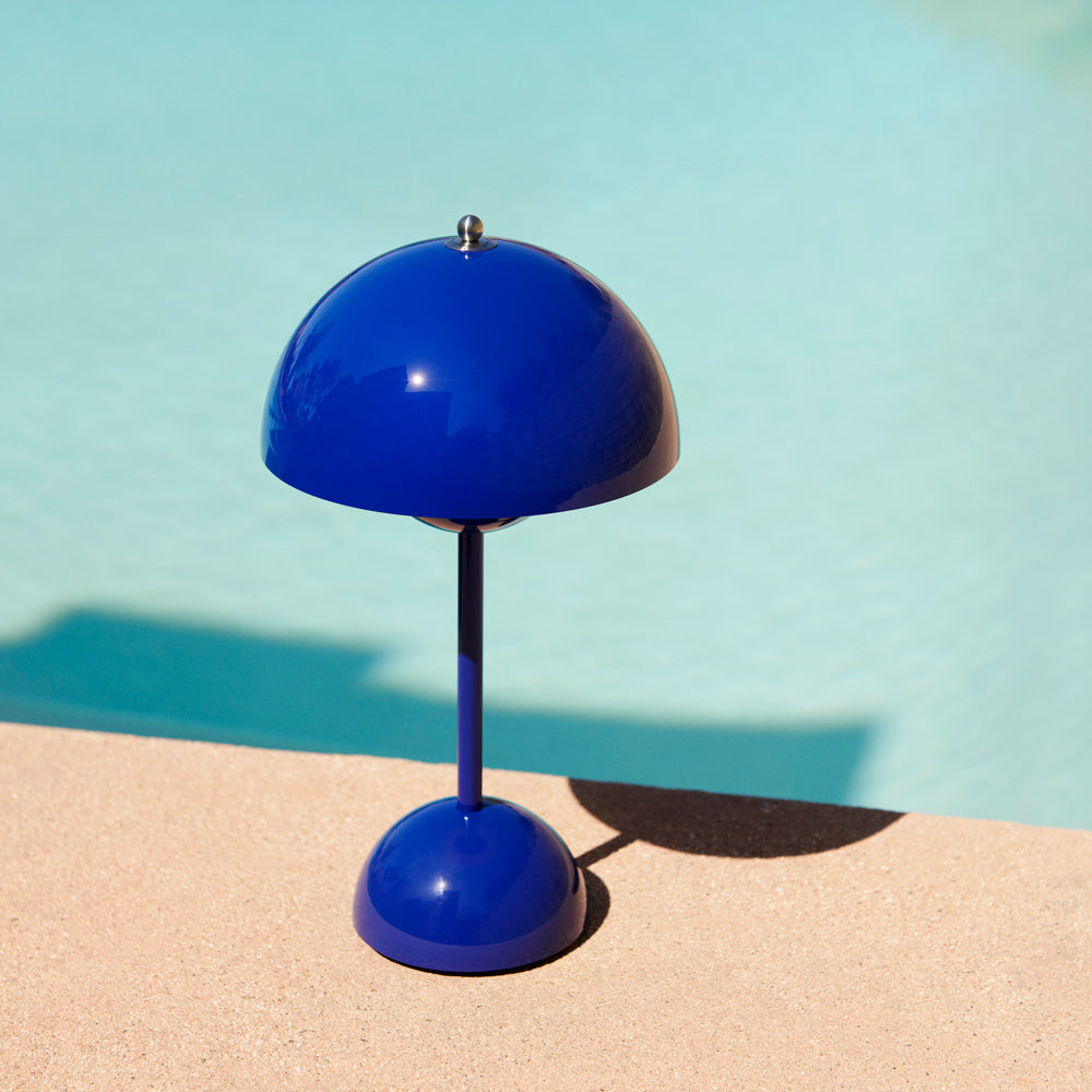 Table lamp next to pool.