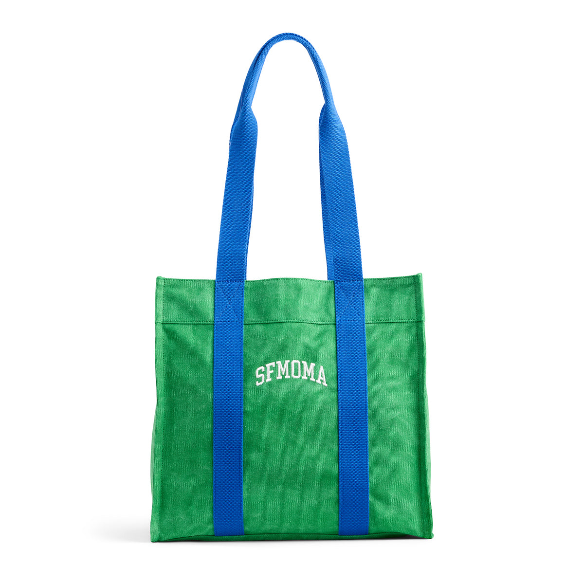 A green canvas tote bag with bright blue shoulder straps and white 'SFMOMA' lettering on the front, shown on a clean white background.