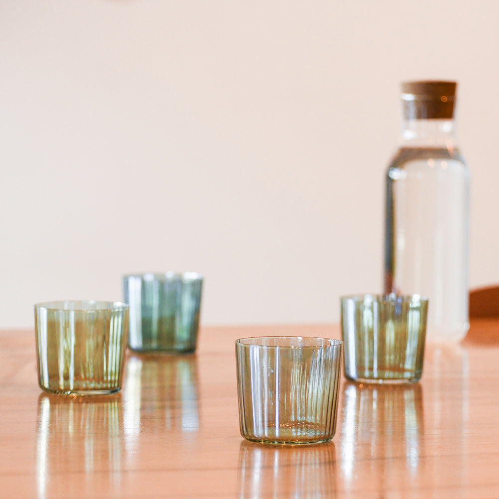 Tumblers with pitcher of water.