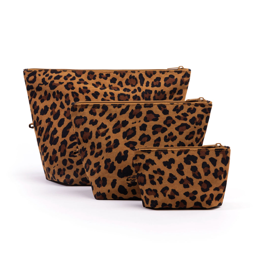 Three leopard print pouches of different sizes on a white background
