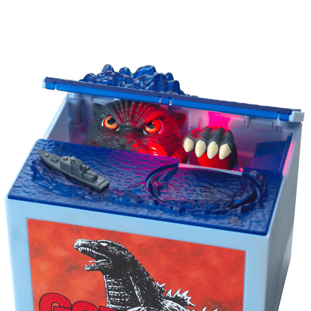 Close-up view Godzilla in coin bank.