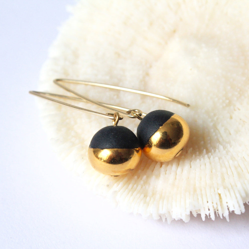 Earrings on fluffy object.