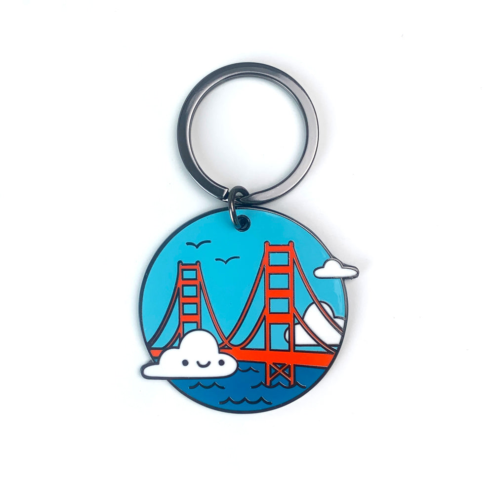 Keychain with a design of a bridge and cloud on a blue background