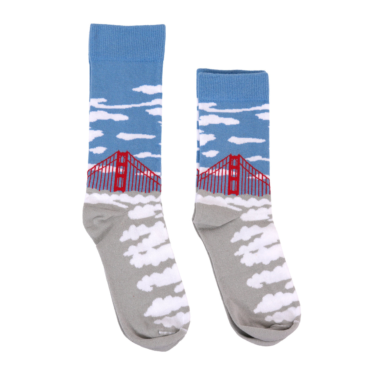 A pair of crew socks featuring a sky and clouds pattern on the upper half and a gray foot with white clouds on the lower half, with a red bridge graphic on the side.