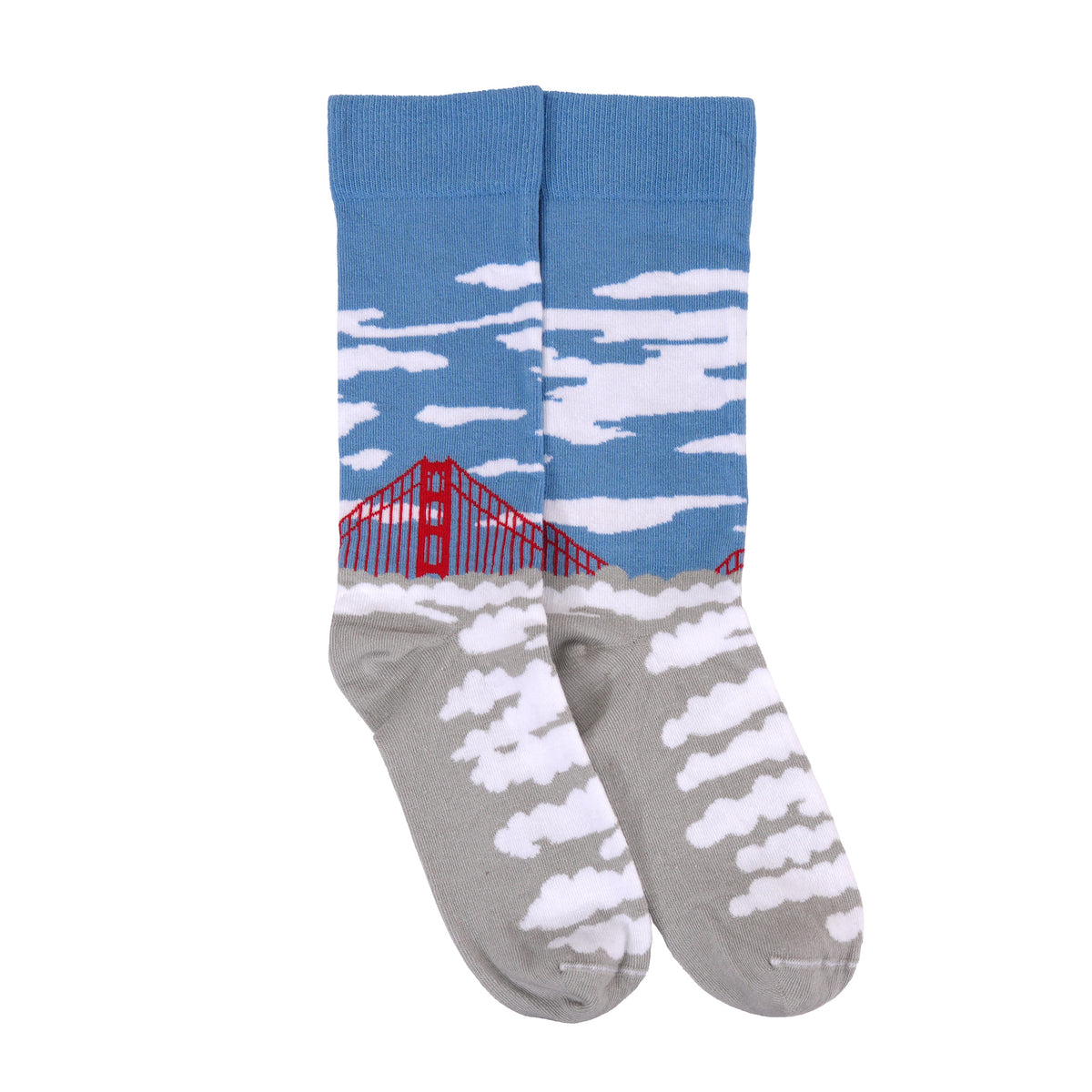 A pair of crew socks with a sky and clouds design, featuring a blue upper section with white clouds and a red bridge, and a gray lower section with white clouds.