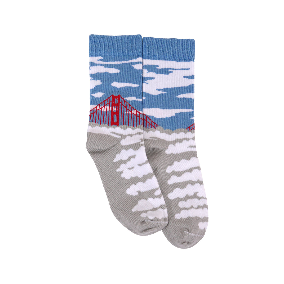 A pair of crew socks featuring a sky and clouds pattern on the upper half and a gray foot with white clouds on the lower half, with a red bridge graphic on the side.