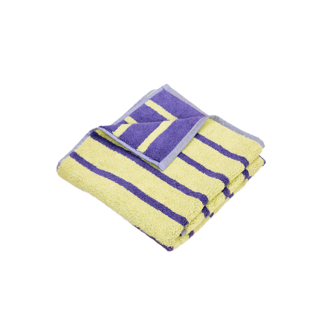 Yellow and purple striped towel on a white background