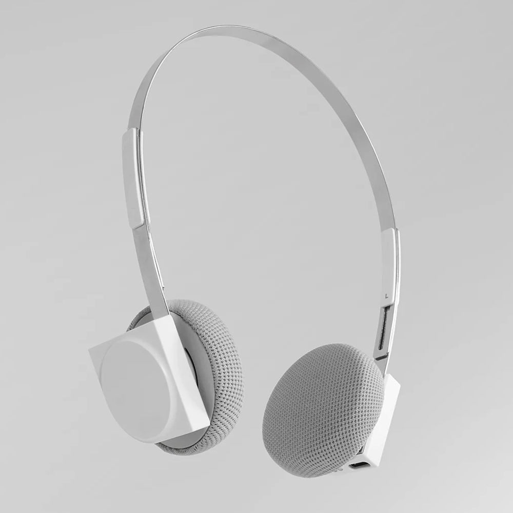 White headphones on a light gray background
