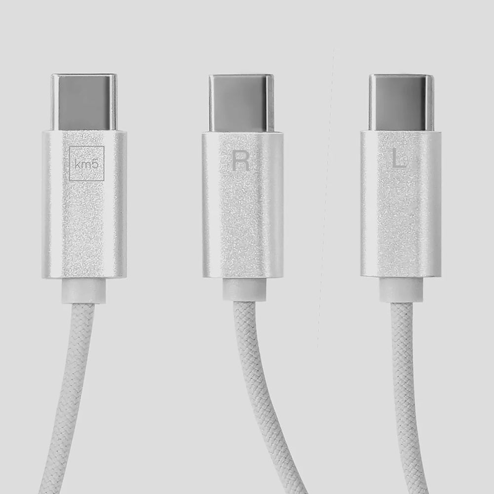 Three metallic USB-C cables with 'L', 'R', and 'Km5' labels on a light gray background