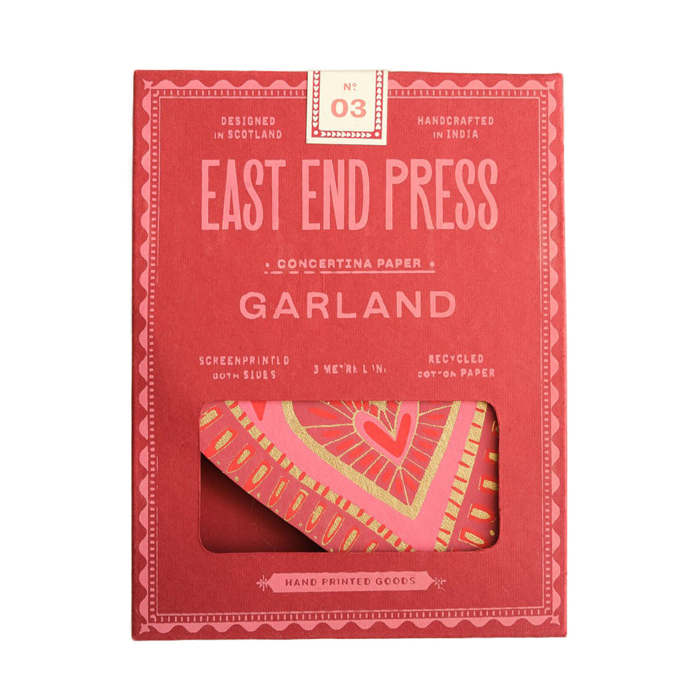 Red packaging of East End Press Garland with a heart design