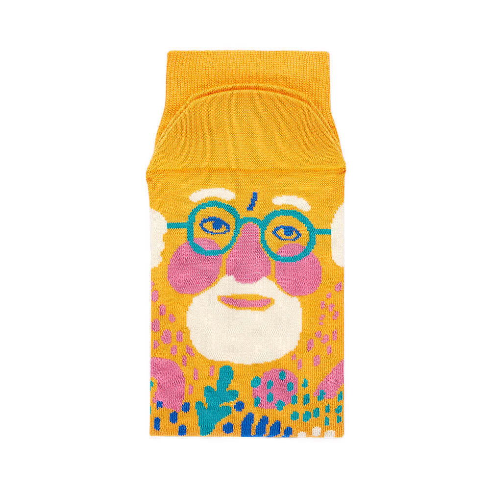 Colorful pencil case with a stylized face design on a white background