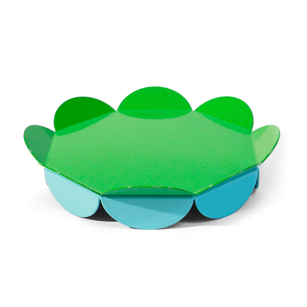 Green and blueflower-shaped serving stand on a white background