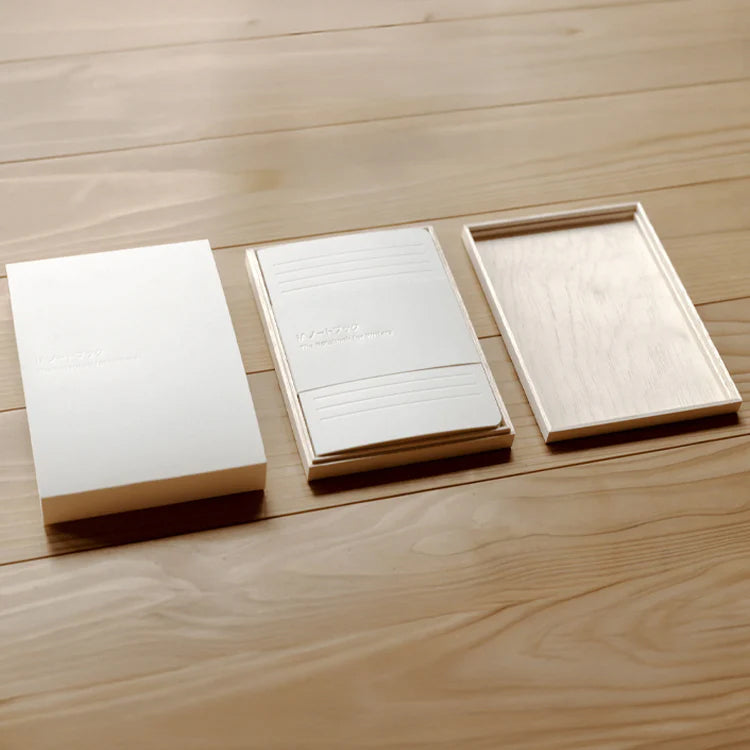 White notebook with line pattern on a white background