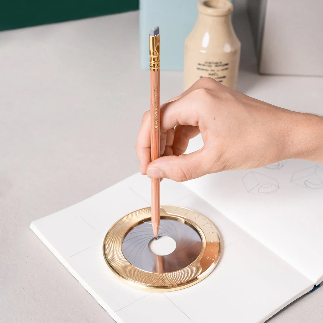Iris drawing tool with gold circular design on a white background
