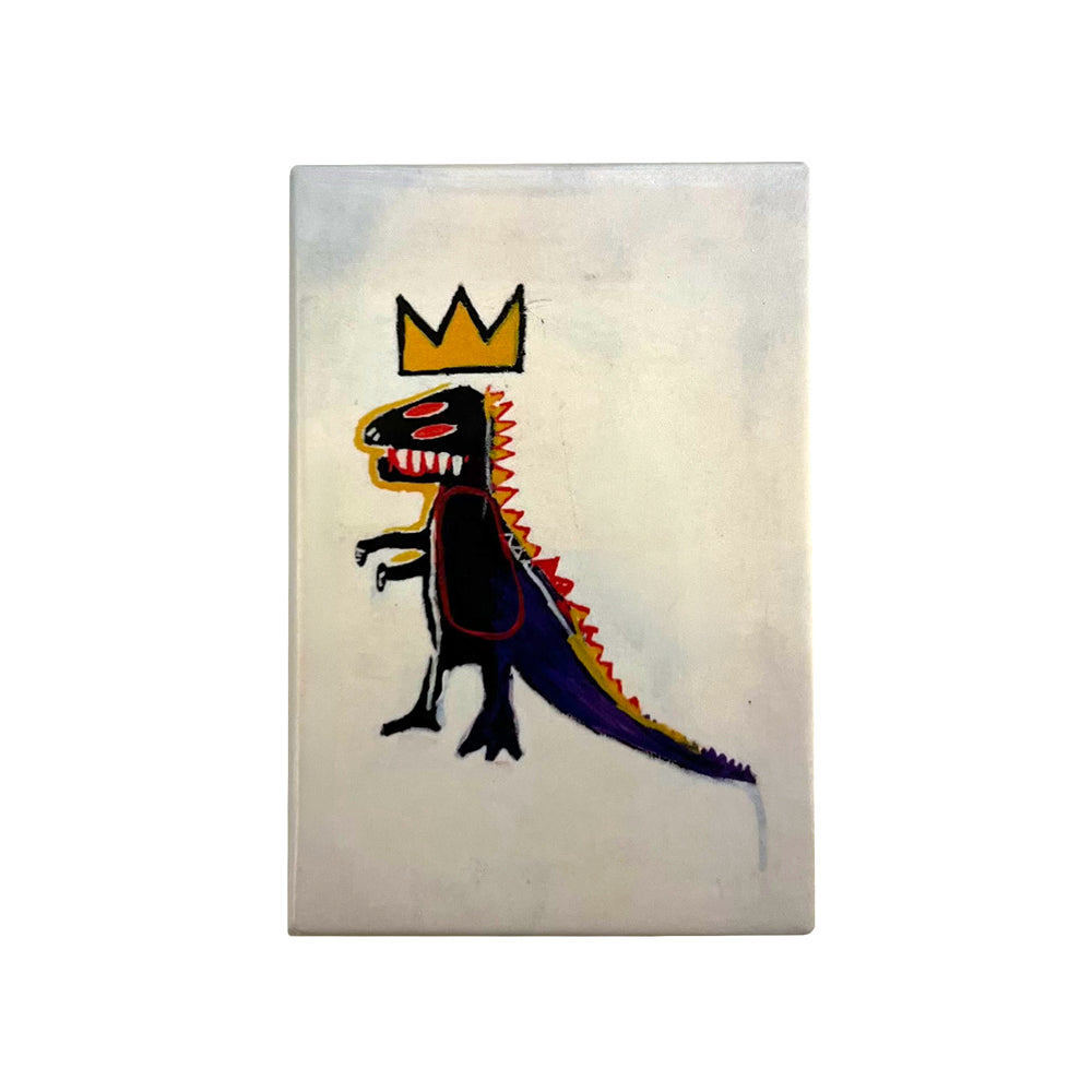 A rectangle magnet featuring a hand-painted black dinosaur wearing a gold crown, set against a light gray background.