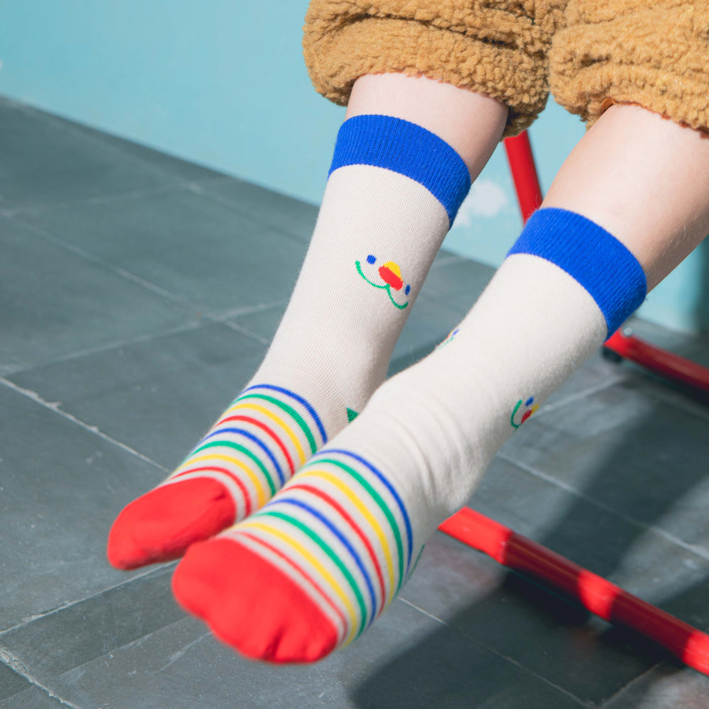 Kid model wearing socks.