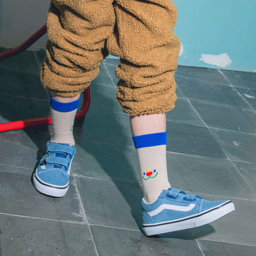 Kid model wearing socks.