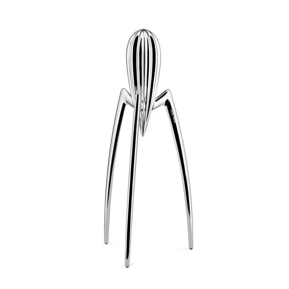 Metallic citrus squeezer on a white background