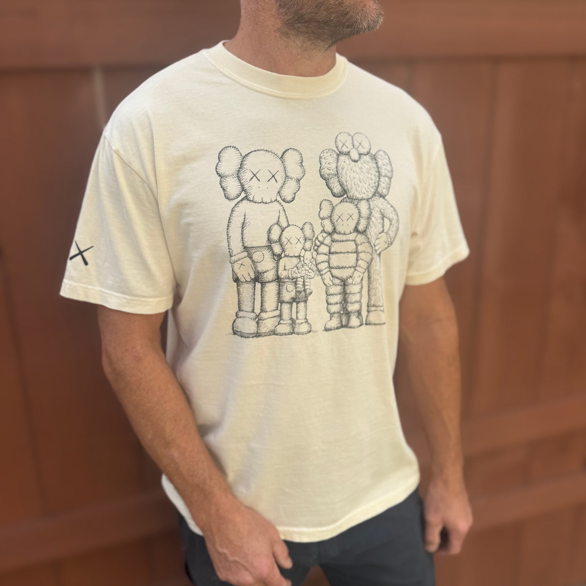 Model wearing KAWS t-shirt.