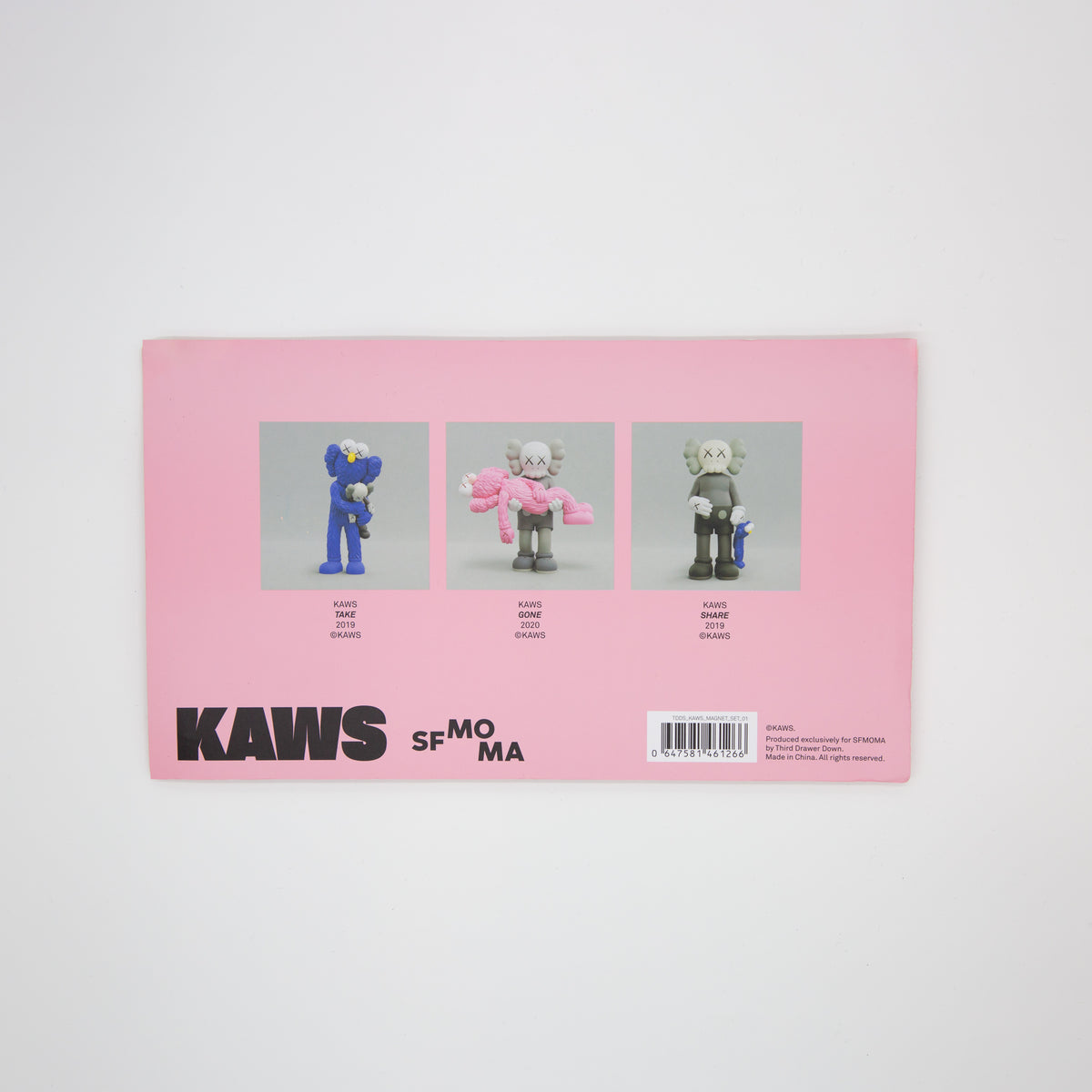 Pink packaging with KAWS illustrations and text on a white background