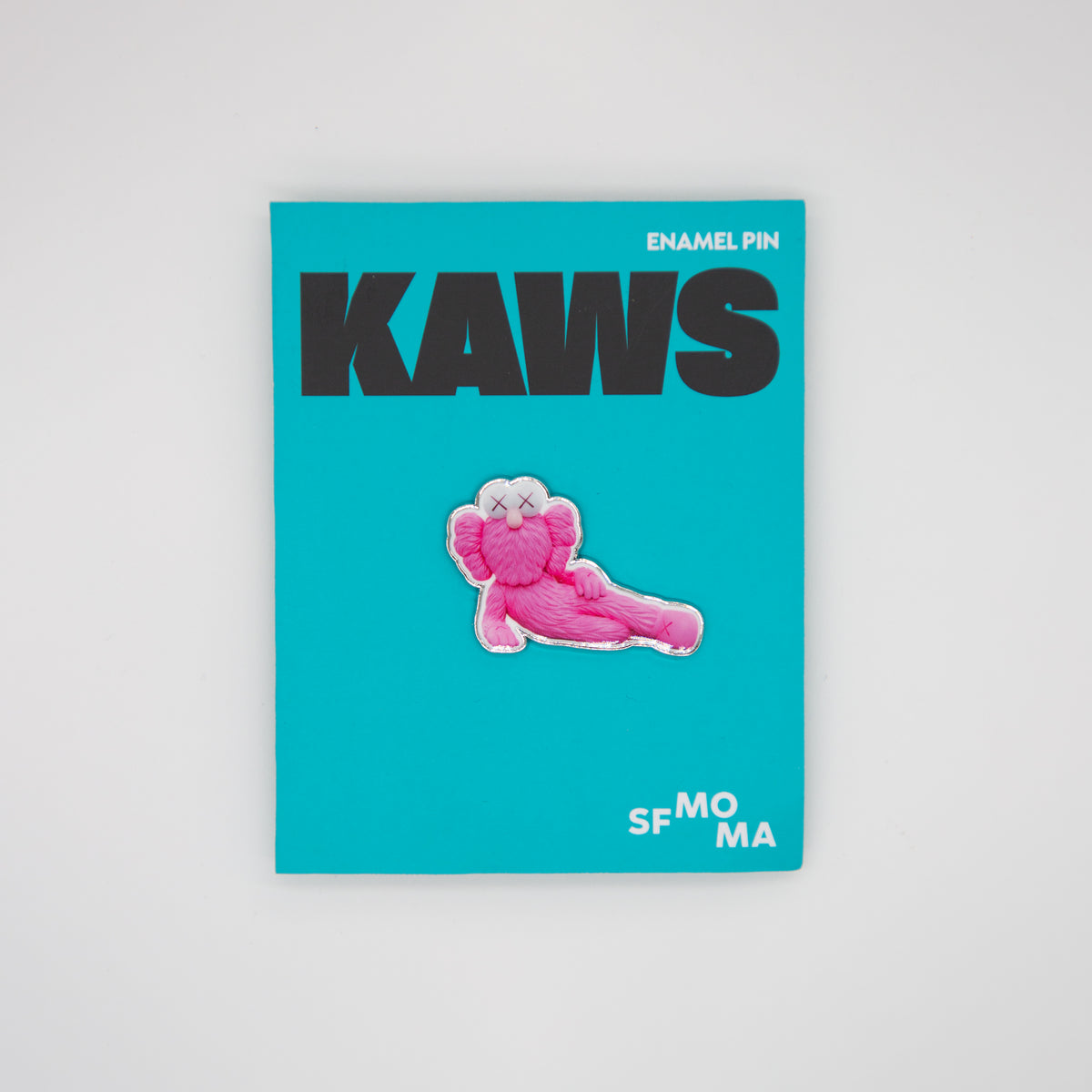 Blue card with pink and white character and 'KAWS' text on a gray background