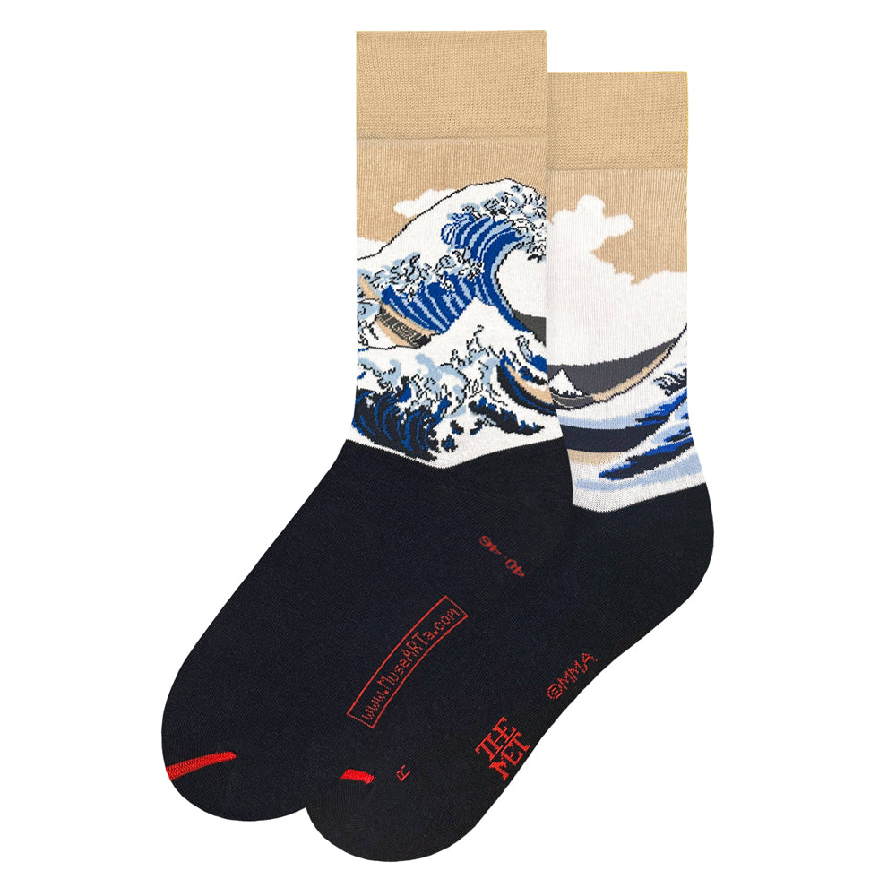 A pair of crew socks featuring a graphic print of 'The Great Wave' on the upper half and a dark navy blue lower half with red text and accents.