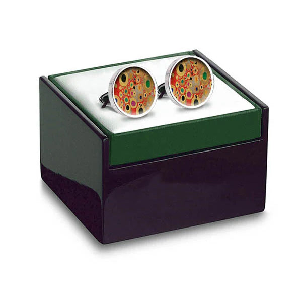 Cufflinks with a colorful design on a green and black box