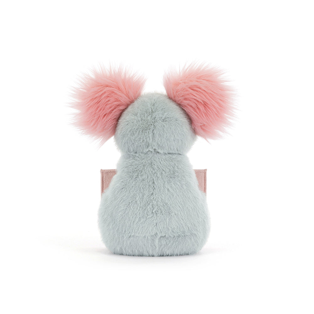 Plush toy with pink pom-pom ears on a white background