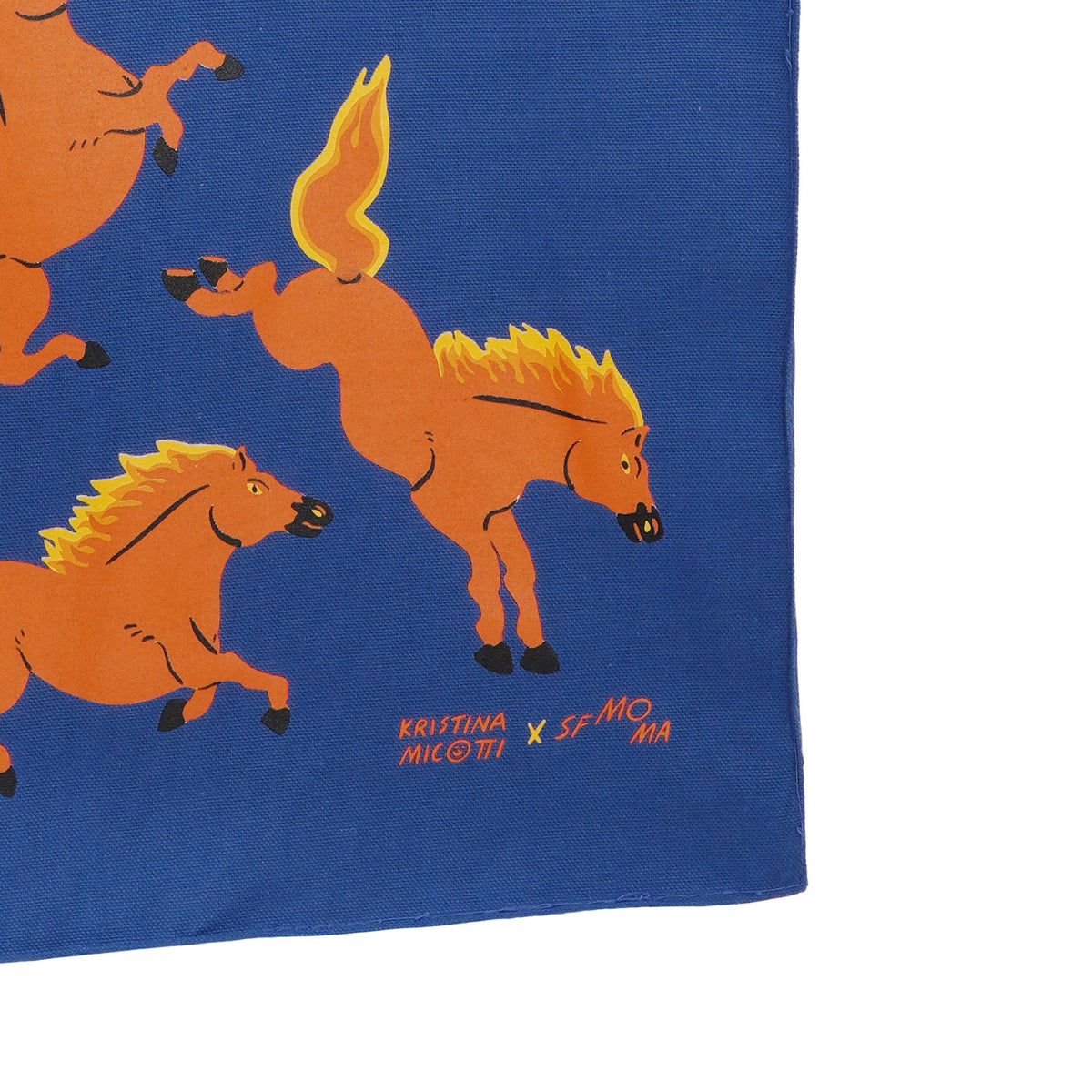 Blue fabric with orange horse illustrations and branding text.