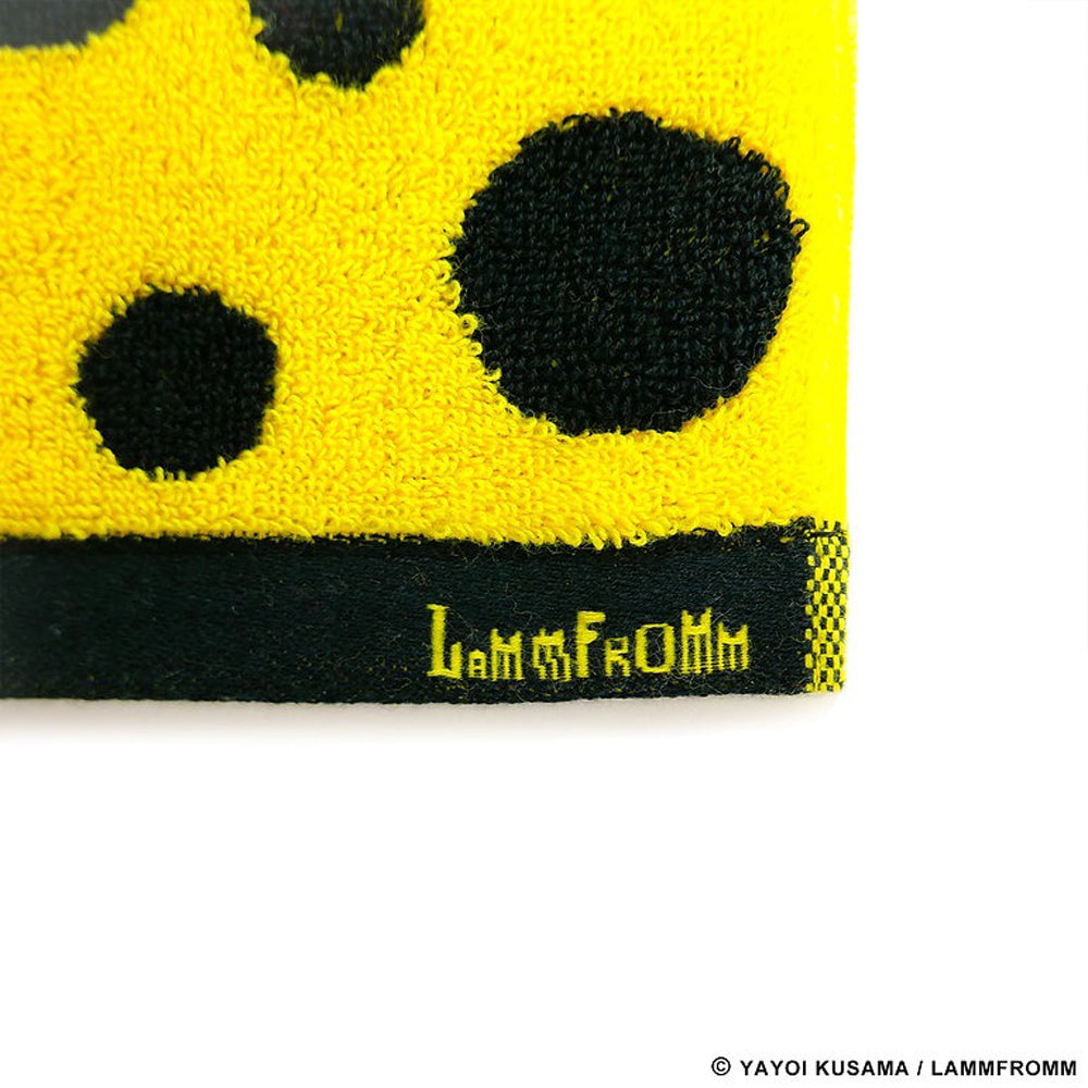 Close up view of tag on Yayoi Kusama Polka Dots Towel: Yellow and Black