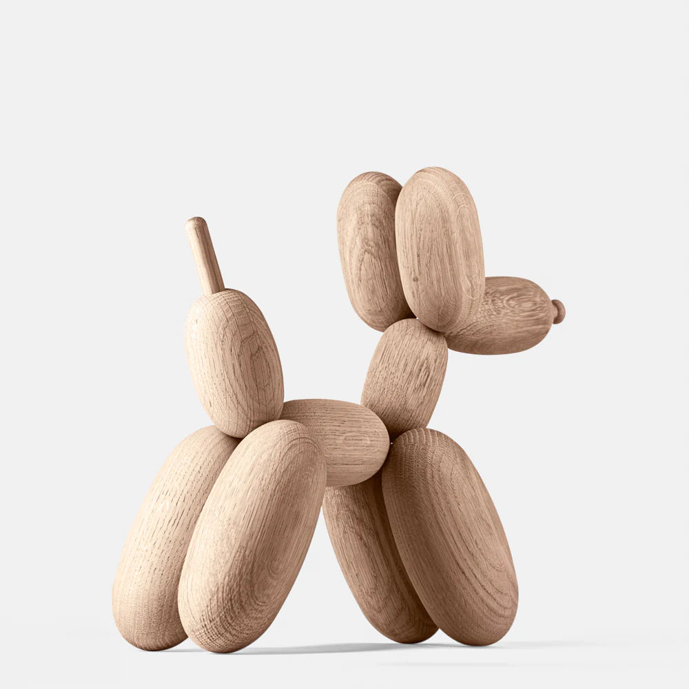 Wooden dog sculpture on a white background
