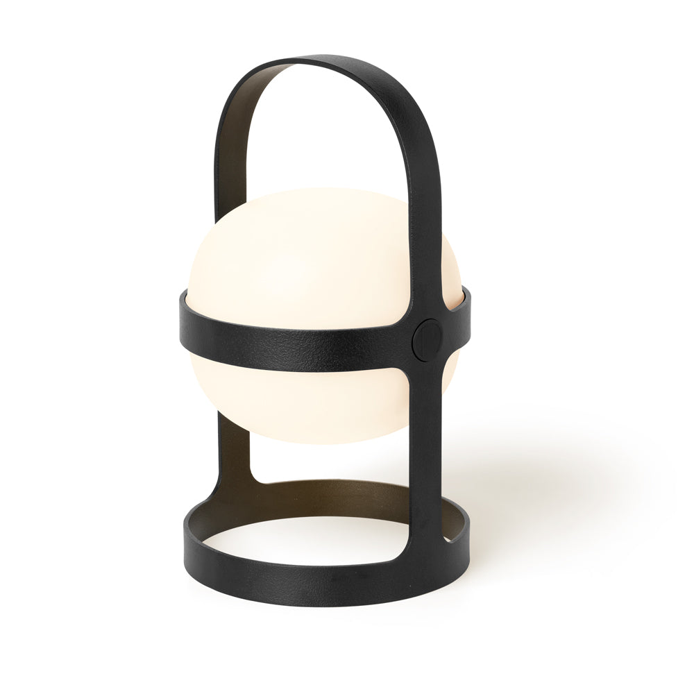 Modern table lamp with black metal frame and white glass shade on a white background