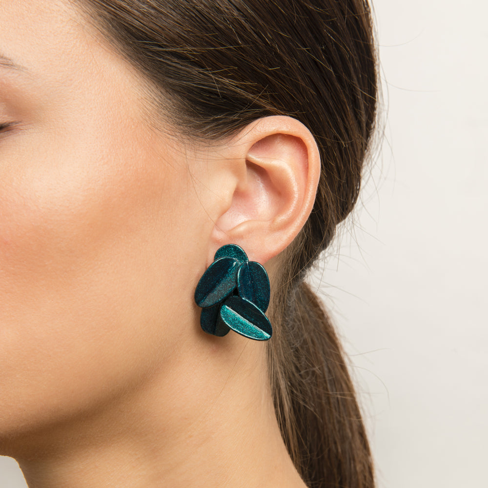 Model wearing earrings.