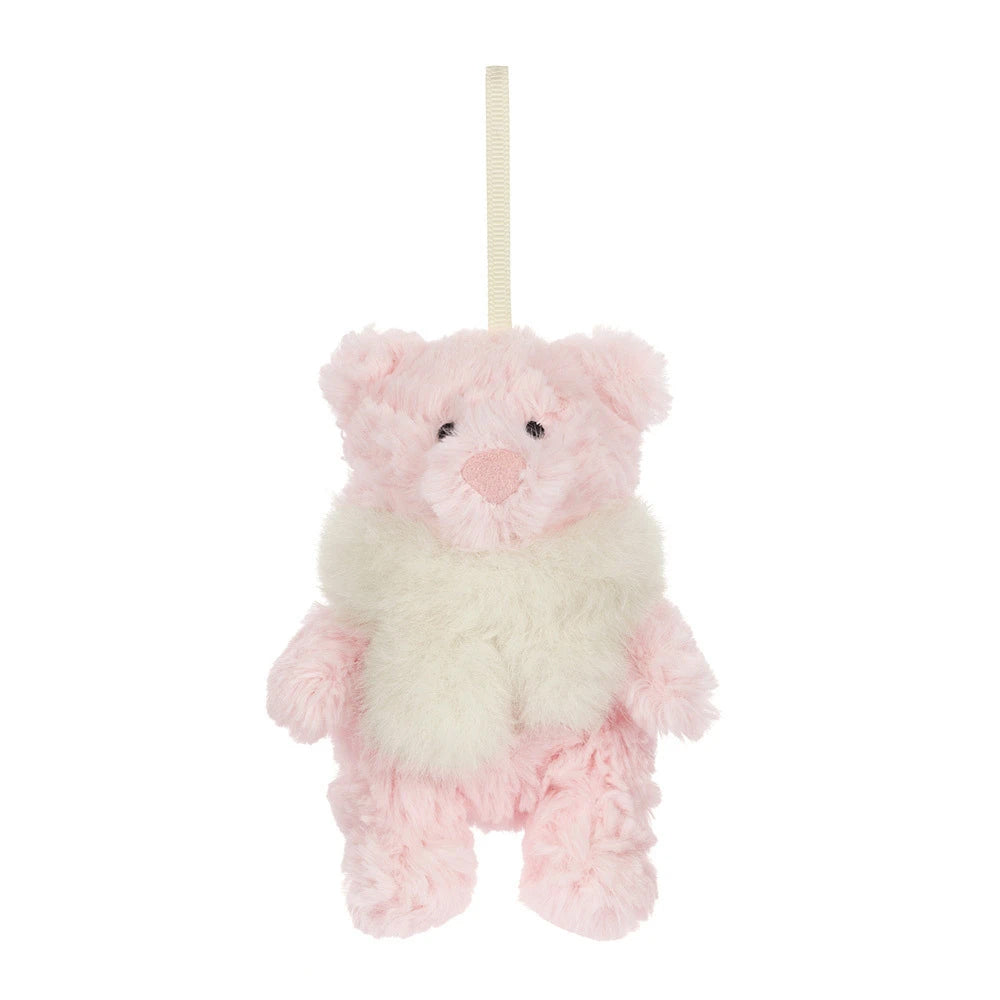 A small plush hanging bear ornament in soft pink and cream white faux fur, suspended by a cream ribbon on a plain white background.