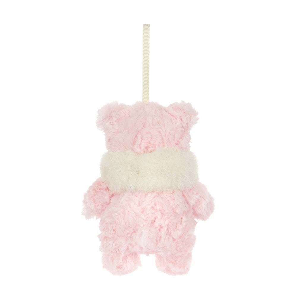 Back view; A small plush hanging bear ornament in soft pink and cream white faux fur.