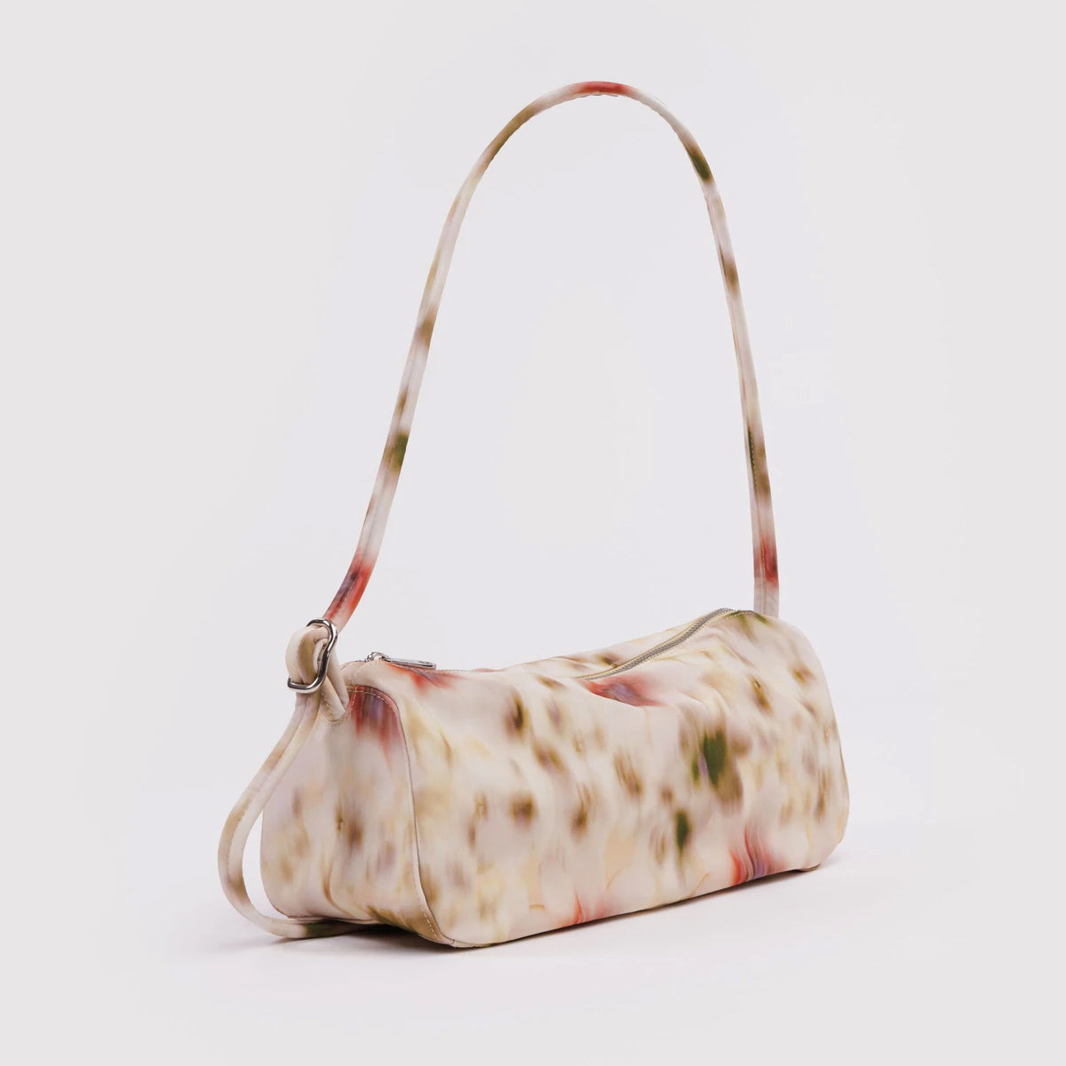Abstract floral patterned handbag on a white background