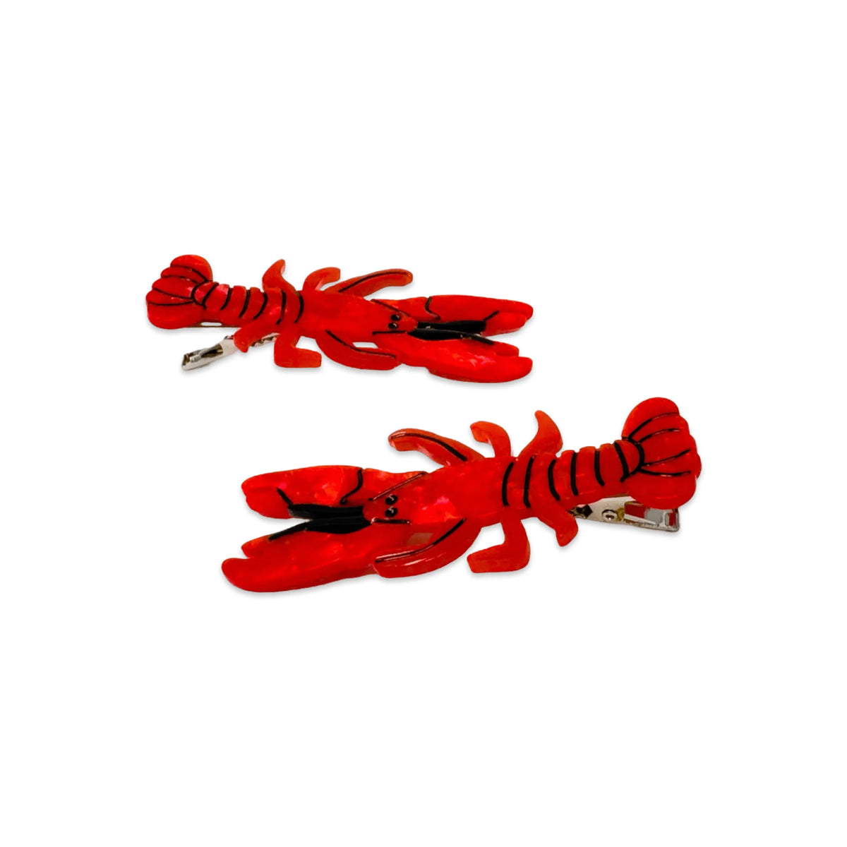Two red lobster-shaped hair clips on a white background