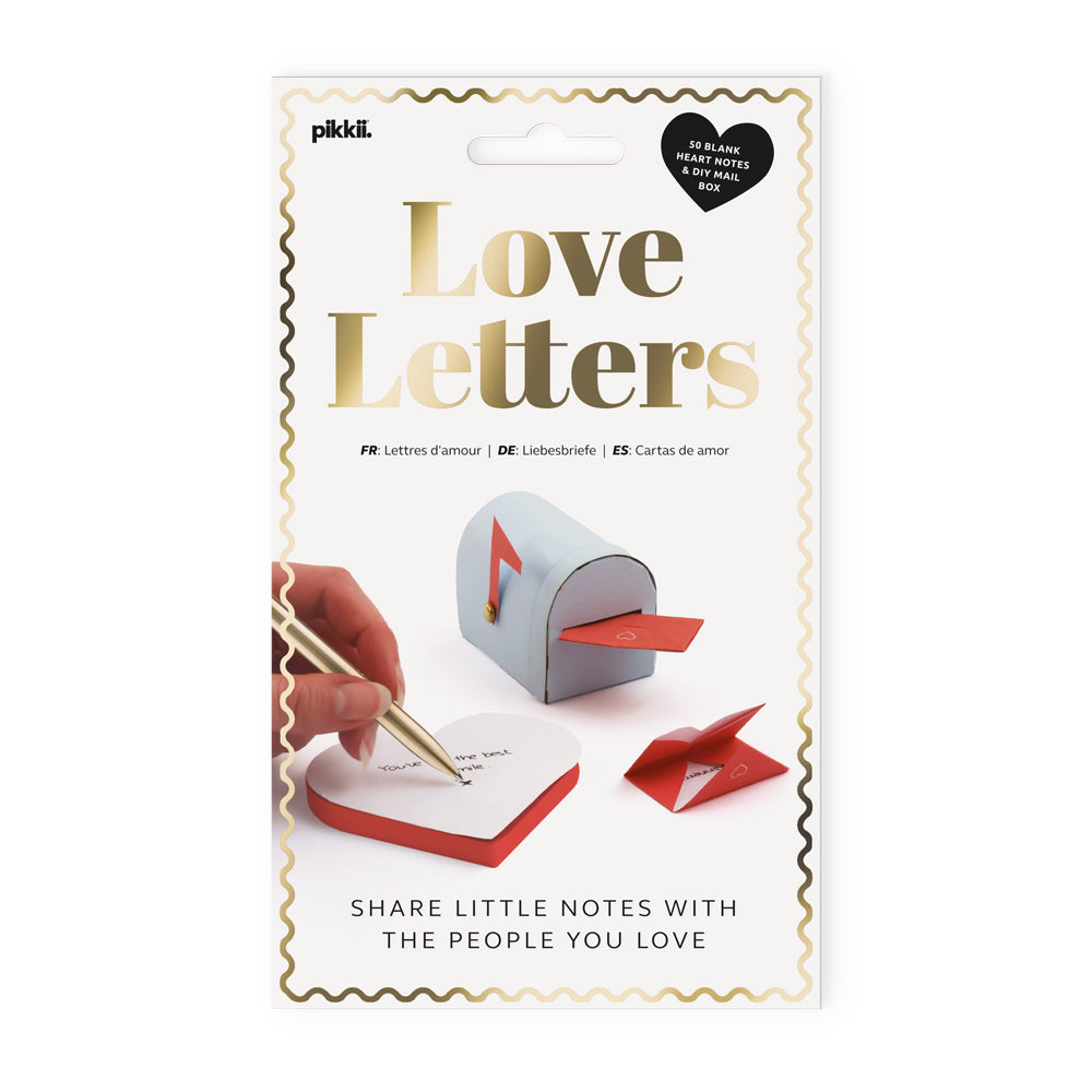 Packaging of 'Love Letters' with a hand holding a pen and heart-shaped paper, on a white background.
