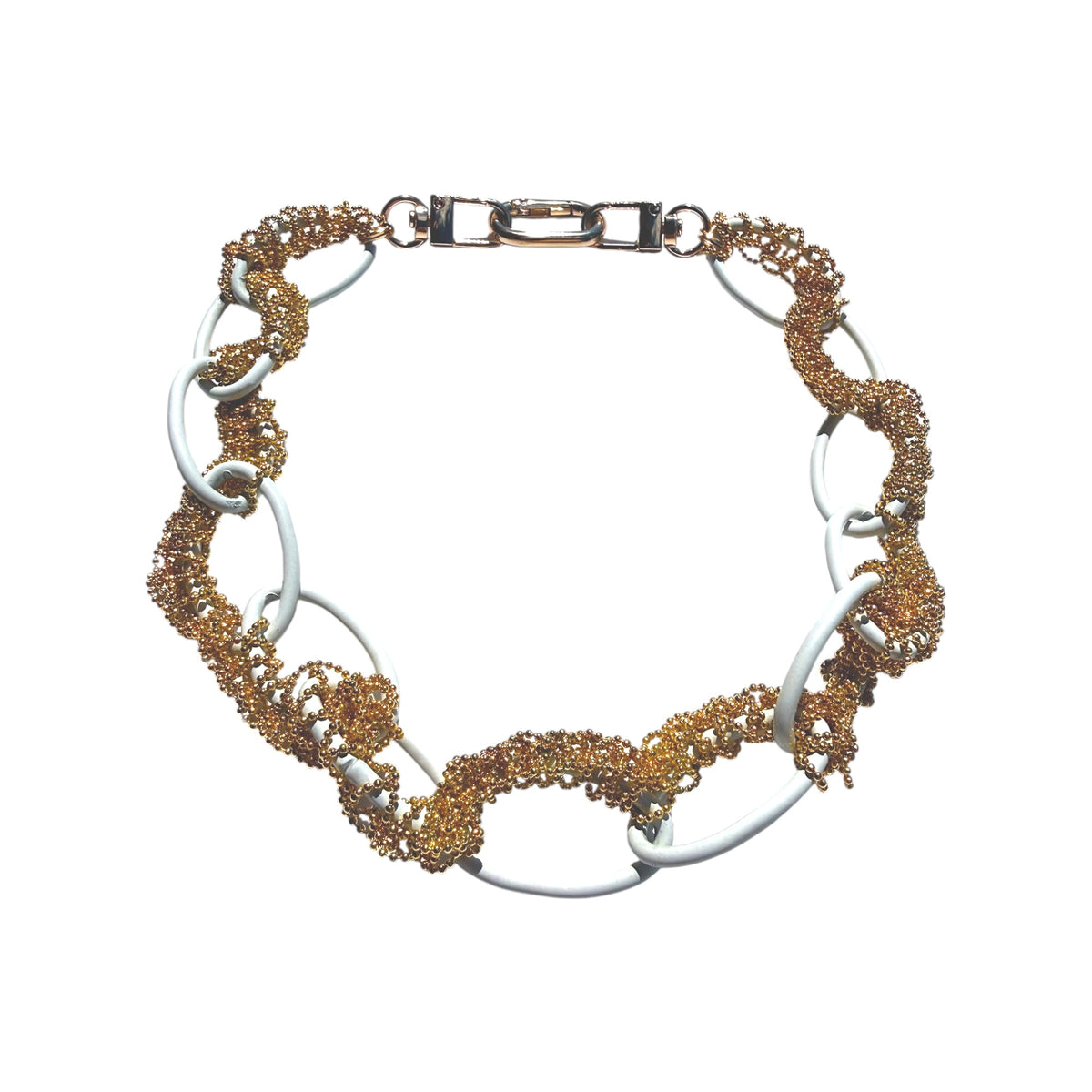 A chunky link bracelet featuring alternating polished silver-tone oval links and textured gold-tone beaded mesh sections, with a lobster clasp closure, shown on a plain white background.