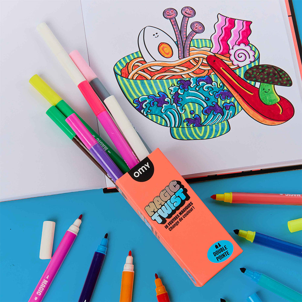 A pack of OMY Magic Twist double pointed markers in a clear plastic tube with a coral orange cardboard sleeve, shown on a white background.